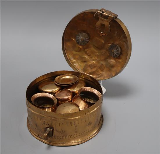 An Indian engraved brass prayer ritual box with lidded box and tray interior.